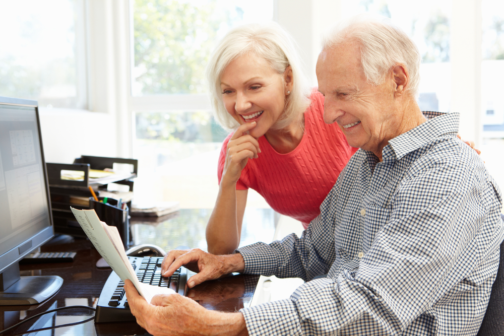 senior couple on a computer