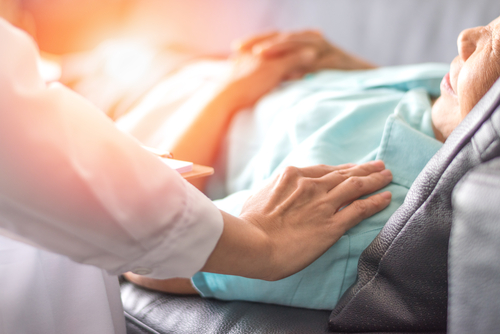 elderly women in hospital bed