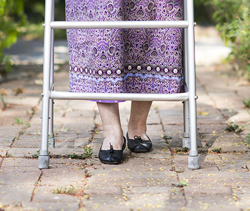 senior woman using a walker