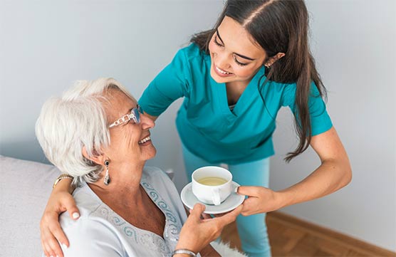 AHHC Home Health Caregiver Helping Elderly Women