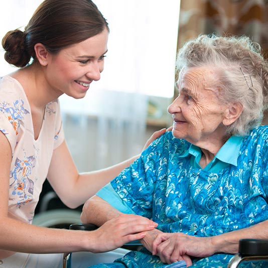 Caregiver and Senior Woman Smiling