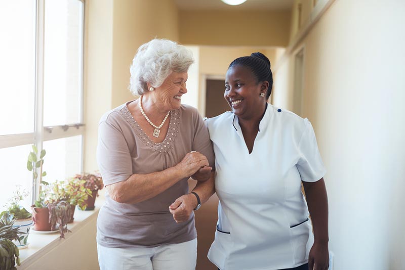 Elderly Woman with Caregiver