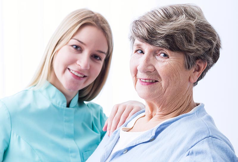 Female Caregiver with Senior Woman