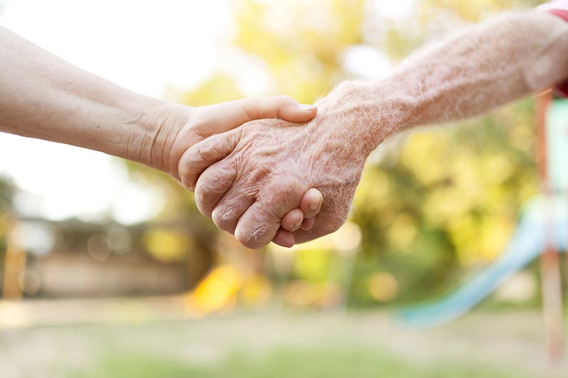 Senior Couple Holding Hands