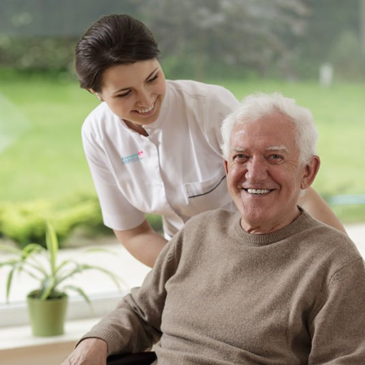 Senior in wheelchair with Caretaker