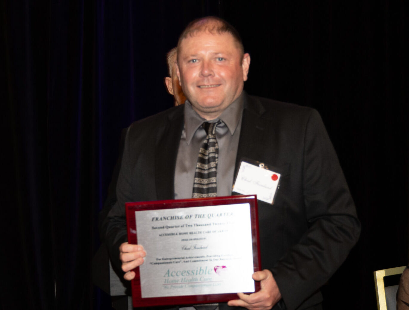 Chad Fernlund holding award