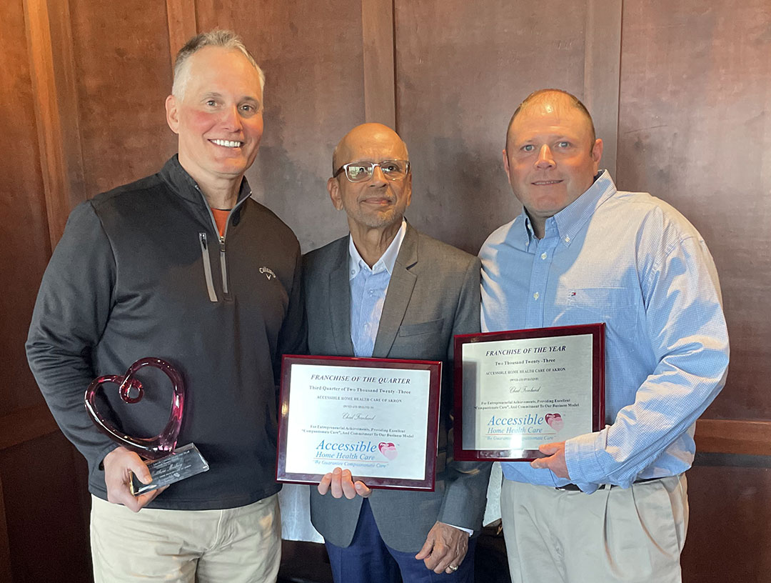 Matthew Mudrey, Aarif Dahod, and Chad Fernlund holding awards