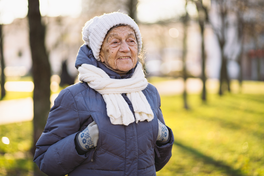 Older woman walking outside